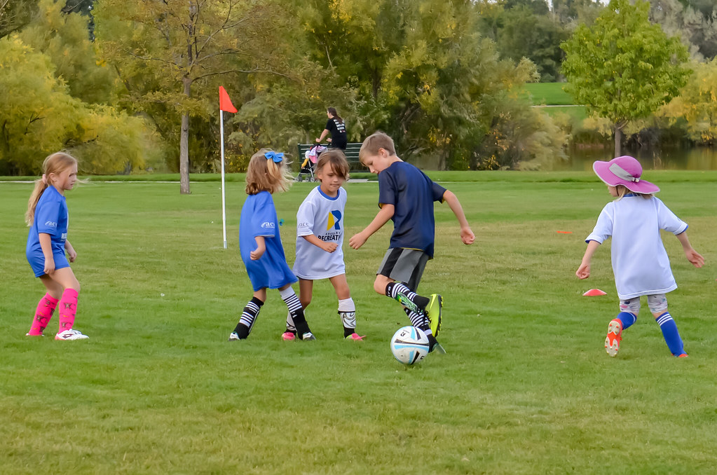 Kids playing sport outdoors in prescription sports goggles